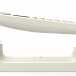 Téléphone sans fil blanc Punkt en lévitation au-dessus de son support